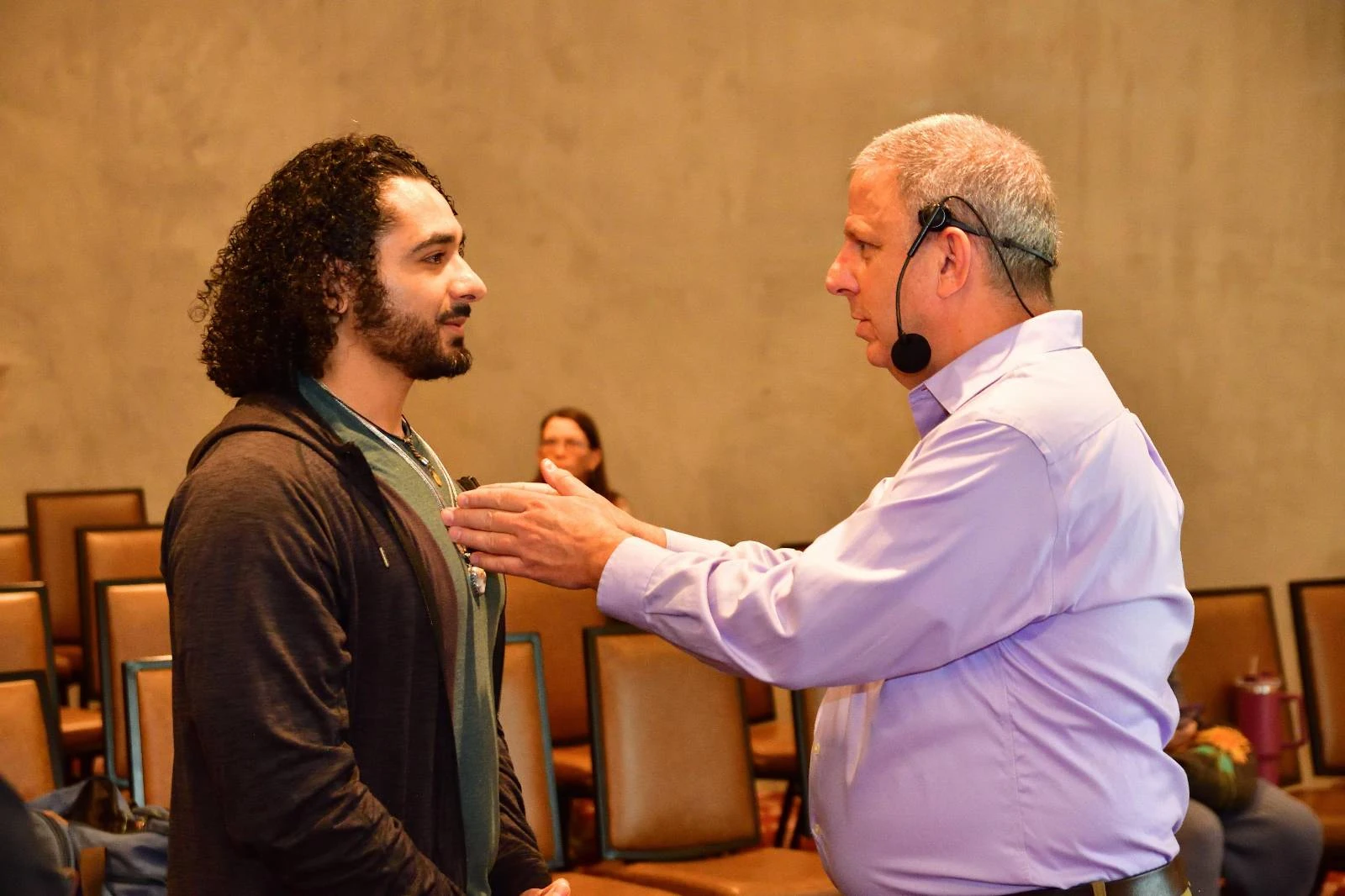 Paul offering face-to-face guidance to a man at a workshop
