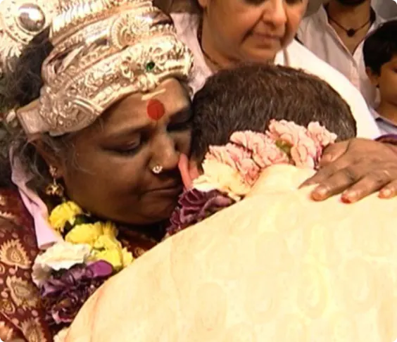 Paul being hugged by Amma